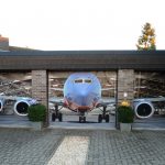 best unique garage doors with plane 3d picture theme plus brick wall and brick paver combined with plant pots