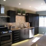 black cabinets for kitchen with metal handles  a set of modern kitchen appliances sink and faucet