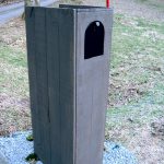 nique modern mail box design with tall idea made of wooden dressed in gray paint with hole and red antena