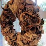 beautiful brown pottery barn wreaths like rose hanging on glass front door