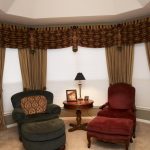 classy window coverings for large windows with brown curtain and drapery plus blinds combined with comfy reading chairs with ottomand and round wooden table