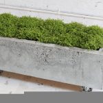 long rectangle concrete planter boxes design with wheels for movable model in rustic style with greenery
