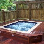 wonderful wooden built in hot tub design with white accent and wooden patio deck with bamboo fence