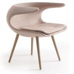 elegant and classy creamy modern chair design in unique shape with four wooden legs of skandinavian furniture austin