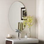 frameless bathroom oval wall mirror design with modern faucet on rectangle sink idea with greenery