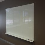 large brown wall painted design with white glass dry erase board from ikea with marker storage aside large glass window