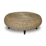 modern minimalsy kid friendly coffe table made of rattan in round shape with black wooden carved legs