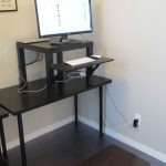 simple black metal ikea stand up desk design in large room with triple tops beneath white wall on black flooring idea