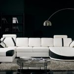 white sectional sleeper sofa in the modern living room  with stylish coffee table and rug plus curved standing lamp and black book case