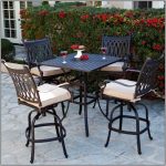 Black metal outdoor furniture with white cushions