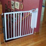 White metal safety gate for kids completed with high tech features