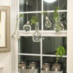 creative and inspiring garden windows for kitchens with hanging greenery pots with glass jar and cans as pot