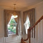 gold tone curtains for casement windows with white walls and elegant gold ceiling lamp and wooden floor