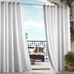 minimalist indoor outdoor curtains in white with wooden chair adorned with striped cushion and greenery