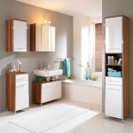 skandinavian ikea bath cabinet design in beige and white color with floating sink and wall storage aside white tub