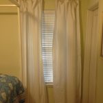 Bamboo Beaded Door White Curtain And Shader Near Blue Bed