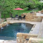 Natural Rectangular Pool WIth Rustic Ceramic And Pool Chairs