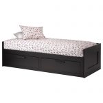 Small Bed With Decorative Design And Two Drawers