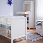 White baby crib IKEA for a nurturing room a white corner chair for nurturing small area rug in strip pattern