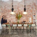 adorable kitchen loft design with industrial style with wonderful white pendants and rustic wooden table and gray chairs and ladder storage