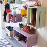 gorgeous modern and floating shoes and boot storage idea with purple and soft blue color on white wooden siding and tile flooring and purple rug