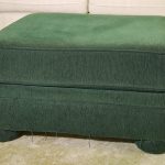 Green slipcover for an ottoman table