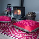 adorable pink moroccan floor cushion idea with ethnic concept on patterned pink area rug with cclassic fireplace and chair