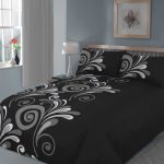 black cool comforter sets in bedroom plus grey wall paint color and wooden bed frame plus white table lamp