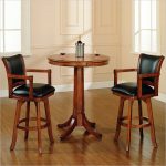 classic round pub tables and black leather upholstery stools completed with back and arm plus gorgeous wooden floor
