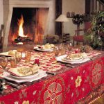 gorgeous red patterned table cloth idea with pine cone and acrylic candle holder and fireplace and golden table