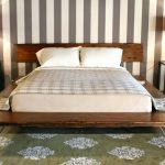Dark and solid wood platform bed frame idea with hair pin legs model  a pair of modern bedside tables with table lamps vertical strip wallpaper idea