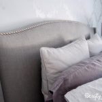 Modern Upholstered Headboard With Nailhead Trim And Pillows