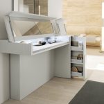 modern and stylish white dressing table with convertible top into mirror and sliding storage on wooden floor