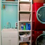vertical laundry room shelf ideas made of wooden with hanging rod and fresh turquoise painted wall