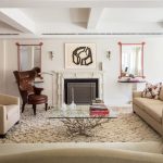 wondrous media room design with fireplace and creamy sofa idea and furry rug and brown leather wing chair and white ceiling