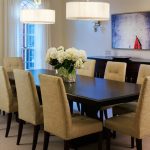 Modern Centerpieces For Dining Room Tables With Flowers Eight Armless Chair And Double Round Decorative Lights