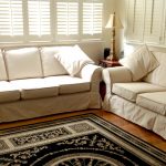 White Double Slipcovers For Leather Couches With Decoeative Rug And Shades On Window