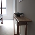 Wooden Shallow Console Table On Grey Wall