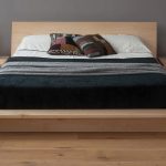 Oversized Zen platform bed idea with headboard a pair of unfinished wood bedside tables