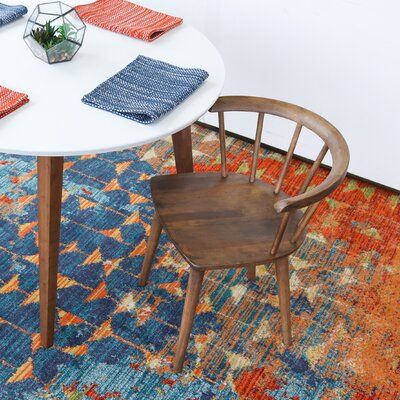 solid wood chair by AllModern white round top table with wood legs colorful area rug