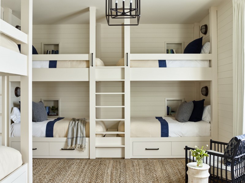 bunk beds with integrated ladder traditional chandelier with black iron structure textured area rug in cream