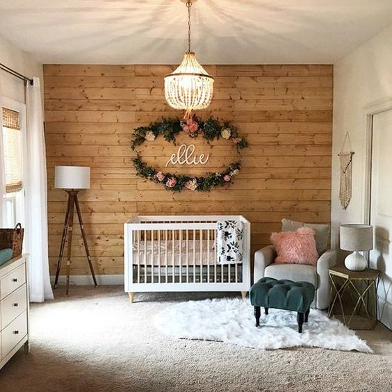 baby crib in white wood cutout wall white area rug light gray nursery chair tripod leg floor lamp with white lampshade