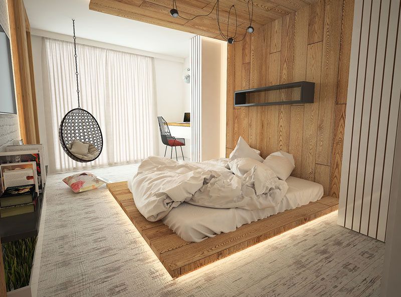ultra modern bedroom idea with hidden lighting under wood platform bed egg hanging chair simple modern shelving unit in black