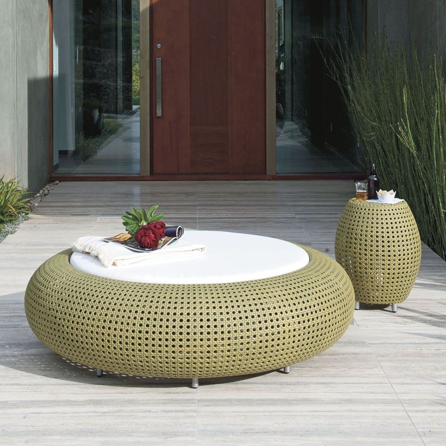 handwoven capsule outdoor daybed with round cushion in white handwoven side table with metal legs